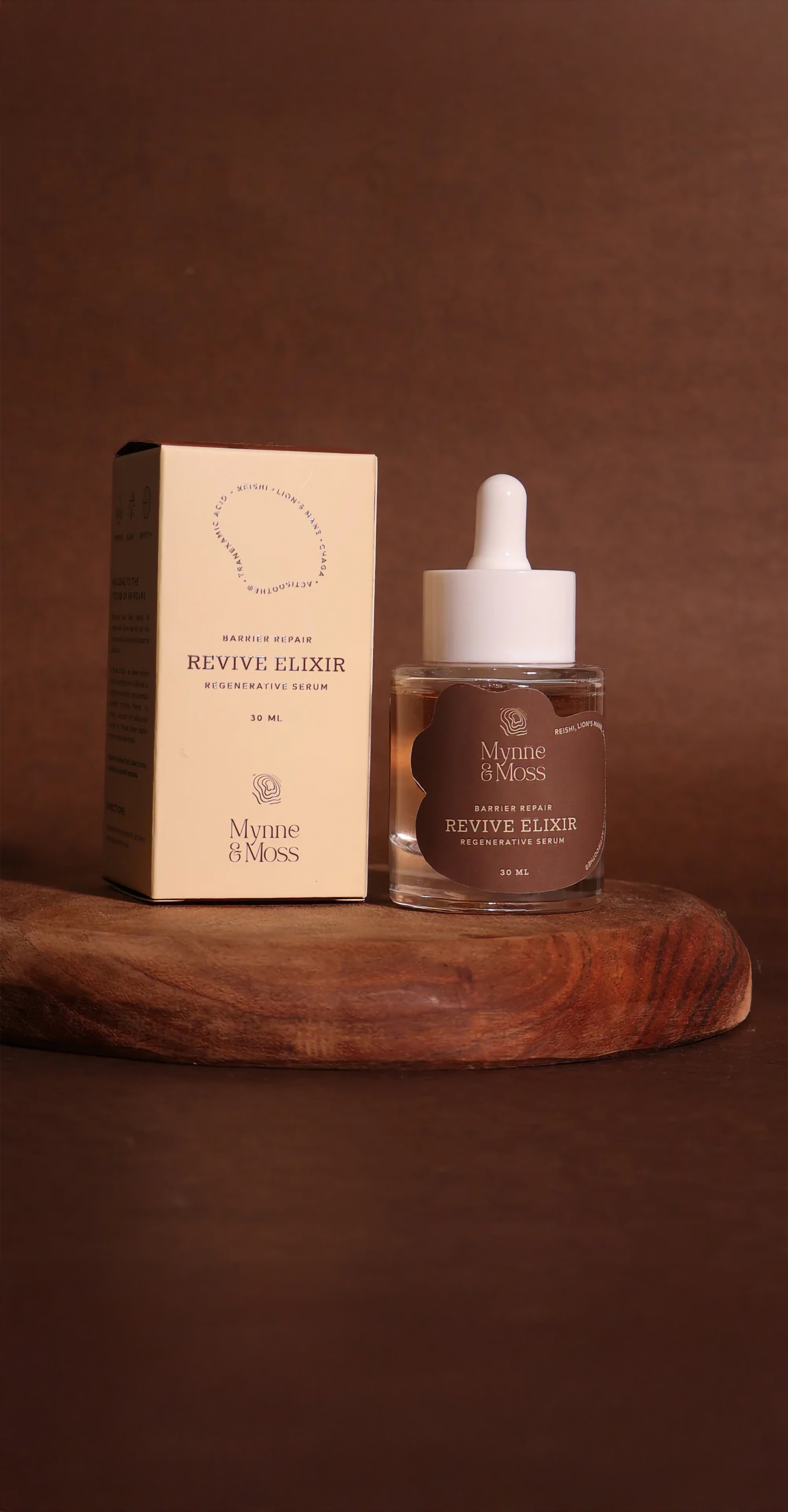 Revive Elixir regenerative serum with its carton on a wooden board