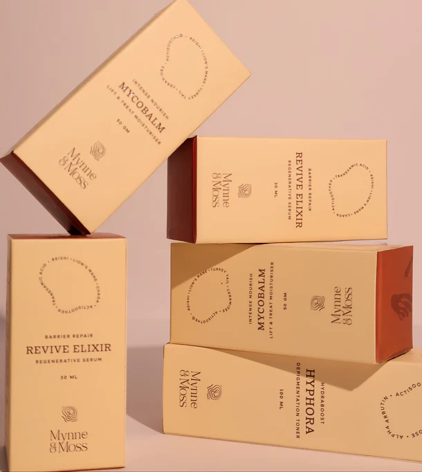 Mynne & Moss product range on brown silk